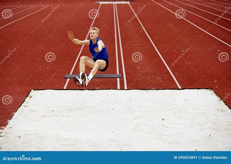 Determination Etched in a Sand Jump Pose. Athletic Man, Professional ...