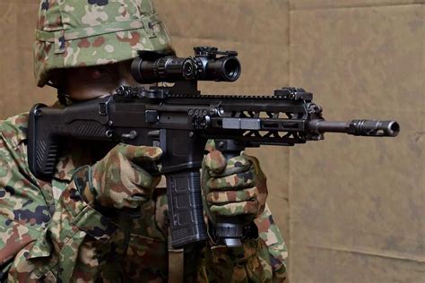 Member of Japan Ground Self-Defense Force holds new HOWA Type 20 ...
