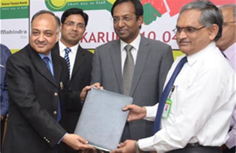 M&M signs MoU with Karur Vysya Bank for car loans and CV finance ...