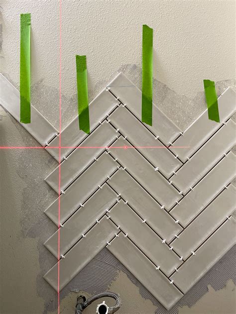 Tiling a bathroom wall in a perfect herringbone pattern – Artofit