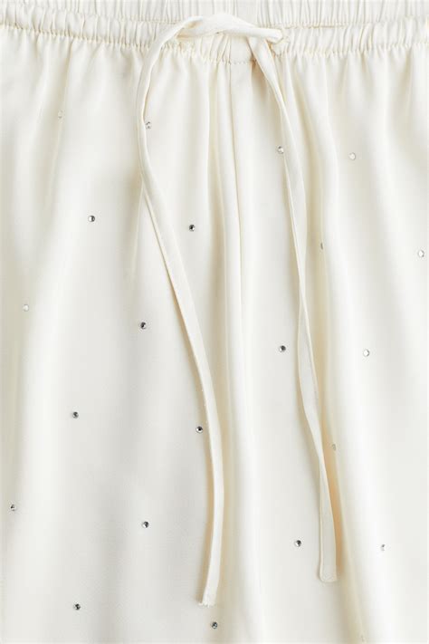 Satijnen pyjamabroek met decoraties - Wit - DAMES | H&M NL