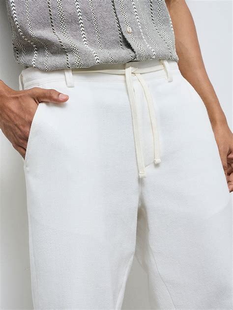 Buy ETA Off-White Solid Relaxed-Fit Mid-Rise Cotton-Blend Chinos from ...