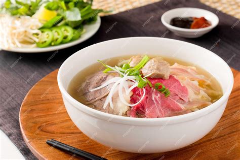 Premium Photo | House special pho - rice noodle soup with rare steak ...