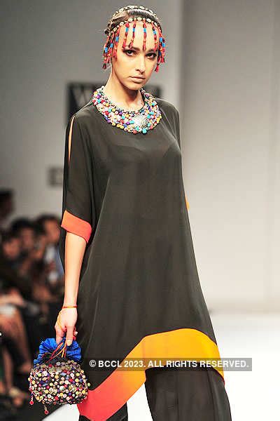 A model showcases a creation by designers Ashima and Leena on Day 2 of ...