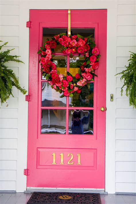 White Brick Exterior With Pink Doors