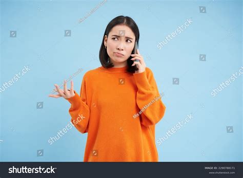 Sad Confused Asia Girl Shrugs Talks Stock Photo 2290788171 | Shutterstock