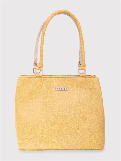 Buy Caprese Pebble Tote Medium Yellow Beige @ Rs.1559 | Caprese Bags