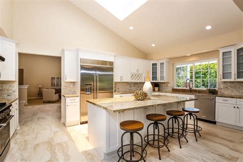 This kitchen feels large and in charge with an open layout and sloping ...