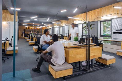 An office of bespoke workstations and breakout spaces | Goodhomes.co.in