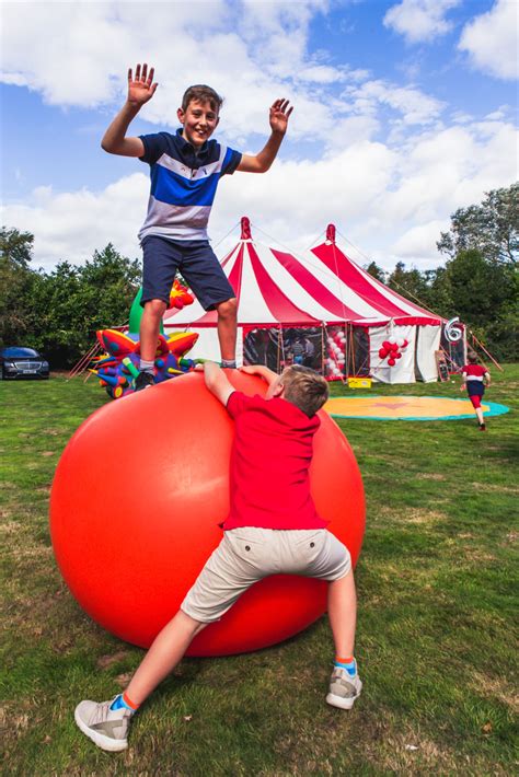 Circus theme luxury children's party in a big top tent with mega ball ...