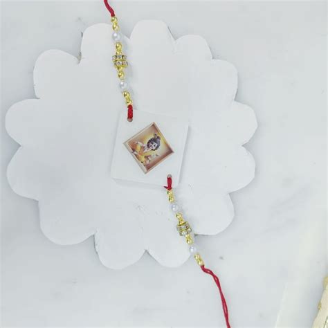 Send Divine Resin Krishna Photo Rakhi Online