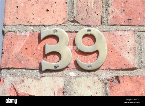 House number 39 sign on wall Stock Photo - Alamy