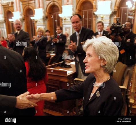Kansas Gov. Kathleen Sebelius greets lawmakers as she enters the House ...