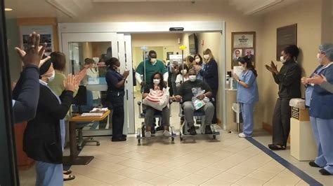 Broward Health employees cheer on couple leaving hospital after beating ...