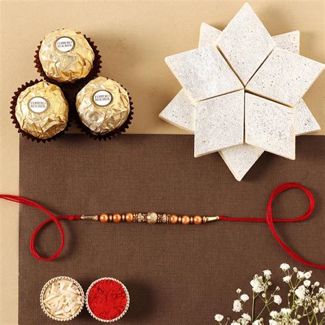 Send Rose Gold Pearl And Beads Rakhi with 3 Ferrero Rocher and Kaju ...
