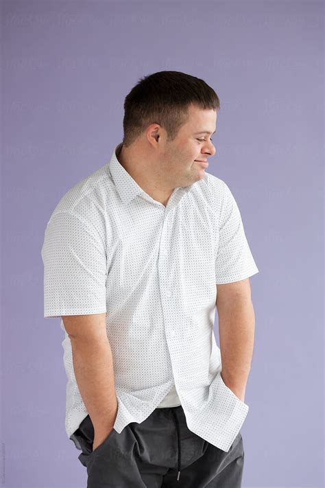 "Portrait Of Handsome Young Man With Down Syndrome" by Stocksy ...