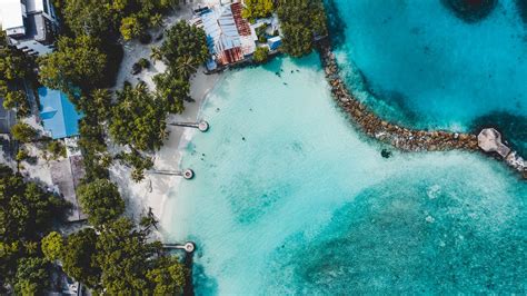 Download wallpaper 2048x1152 beach, island, ocean, bungalow, aerial ...