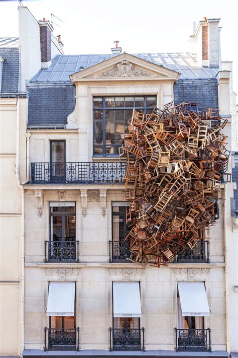 thisiscolossal: A Sprawling Nest of Vintage Wooden Chairs Perches on ...