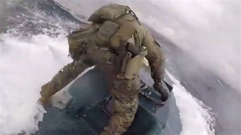 Video shows US coast guard leaping on to submarine carrying 17K pounds ...