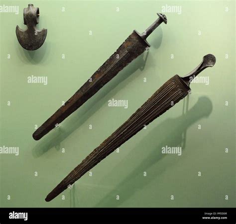 Kingdom of Urartu (9th-8th century BC). Batlle axe and swords. Bronze. The State Hermitage ...
