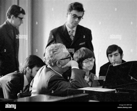 Composer Aram Khachaturian behind a piano among his students Stock ...