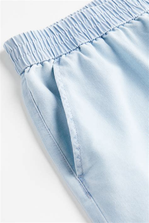 High-waisted woven joggers - Light denim blue - Ladies | H&M IN