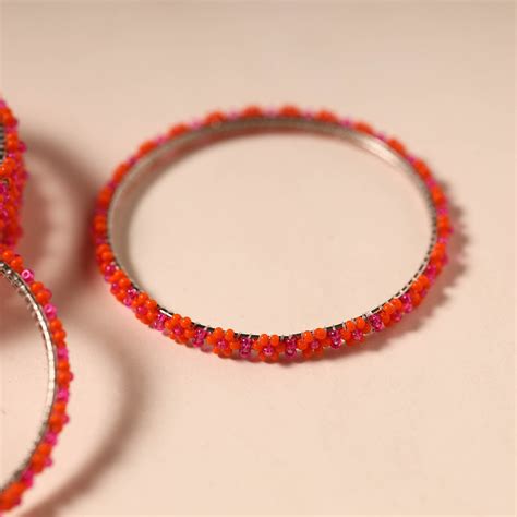 Red Hapur Flower Beadwork Bangles by Aagaz (Set of 6)