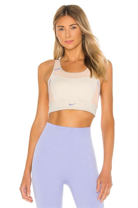 Nike Swoosh Pocket Pad Sports Bra in Light Cream, Washed Coral & Light ...