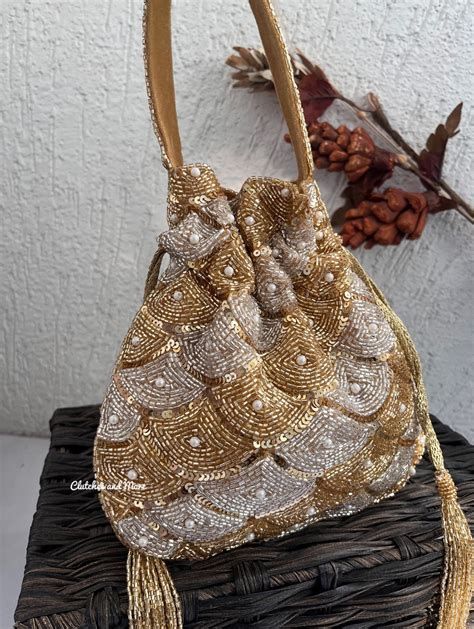 Aadhya Silver Gold Potli | Clutches and More