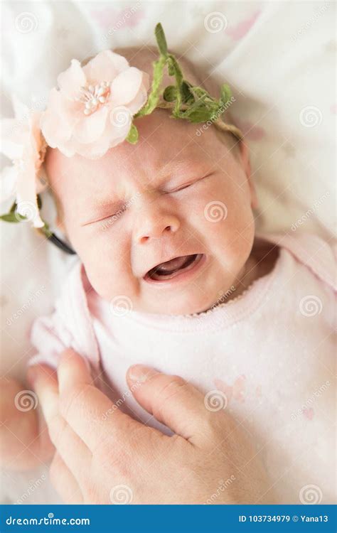 Newborn Baby Screaming in Pain with Colic with Mother`s Hand on Stock ...