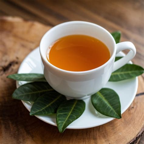 Vibrant orange liquid in cup enhances warm ambiance on wooden surface ...