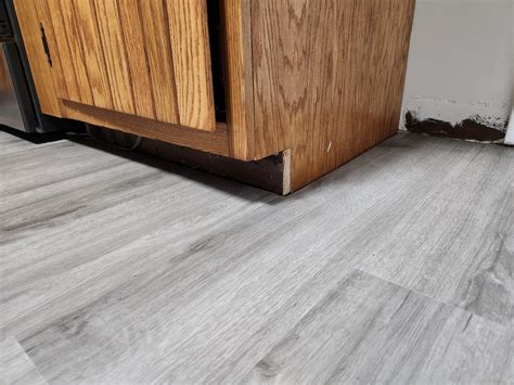 How to finish kitchen cabinets floor trim? I'll put baseboard in the ...