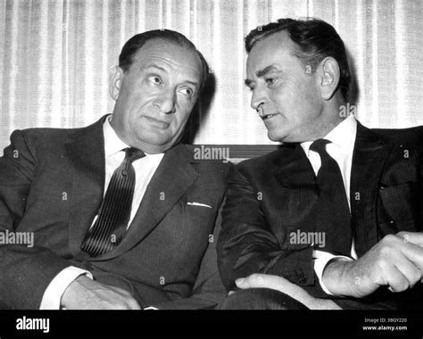 Producer Sam Spiegel (left) with British Director, David Lean, talking at a conference. 17 ...