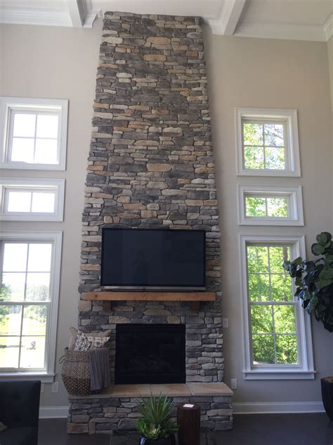 Floor to Ceiling Stacked Stone Fireplace