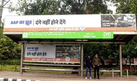A poster against the AAP, placed at a bus stand by the BJP ahead of the ...