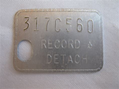 Vintage Record & Detach Tag Token 317C560 | eBay
