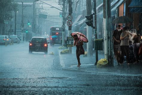 People Walking in Heavy Rain in City · Free Stock Photo