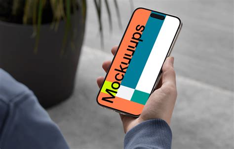 Free iPhone Hand Mockup - Mockuuups Studio