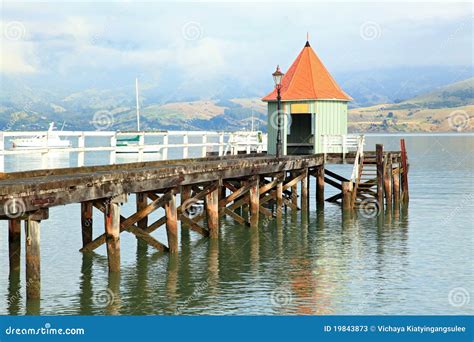Akaroa jetty New Zealand stock image. Image of beach - 19843873