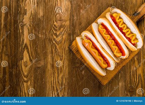 Three Classic Hot Dogs with Ketchup and Mustard Stock Photo - Image of ...