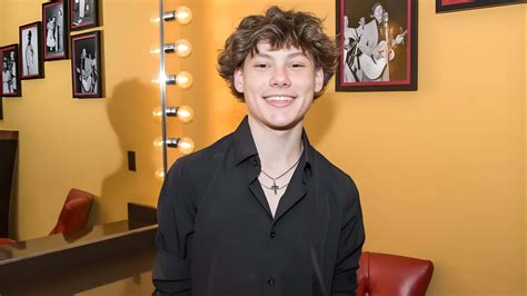 Download Maddox Batson Smiling Portrait Wallpaper | Wallpapers.com