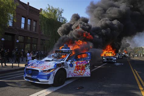 LA Protests: Photos Show Waymo Cars on Fire in Riots - Newsweek