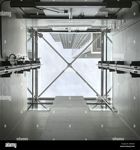 Looking up at sky and skyscrapers in California Plaza, Downtown, Los Angeles, from inside an ...