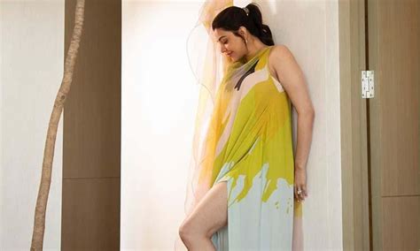 Kajal Aggarwal rocks the summer fashion in a thigh-high slit maxi dress