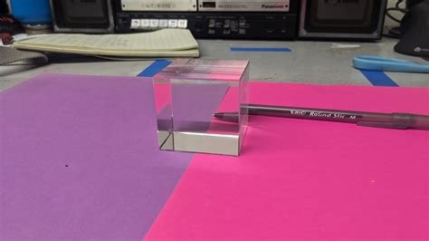 Glass cube demonstrates reflection, refraction, and total internal ...