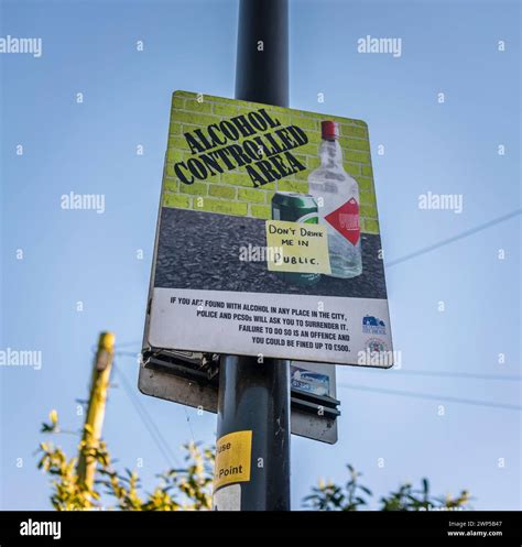"Alcohol controlled area" sign near a university to prevent alcohol ...