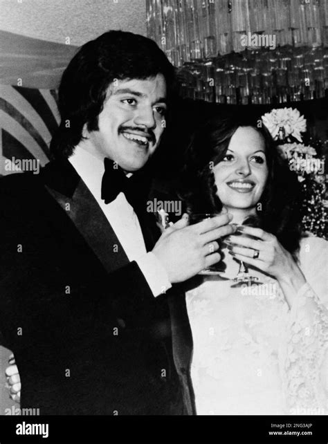 Actor Freddie Prinze is shown toasting his bride, Katherine Cochran, on ...