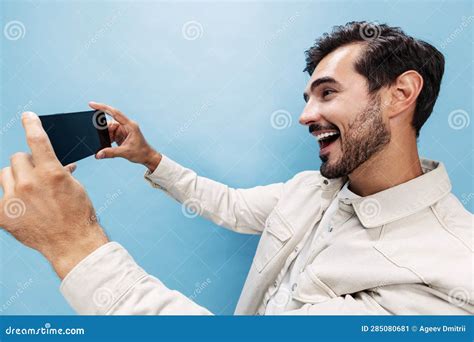 Portrait of a Stylish Brunette Man Shooting Himself on the Phone ...