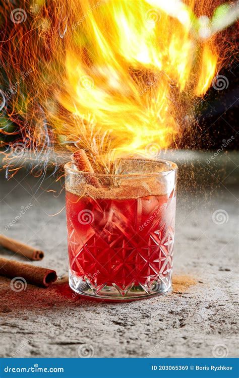 Cocktail with Whiskey and Cinnamon Stick with Rosemary Twig Side View ...