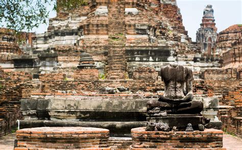 Old Buddha statues and pagodas of Wat Phra Ram, Ayutthaya, Thailand. It ...
